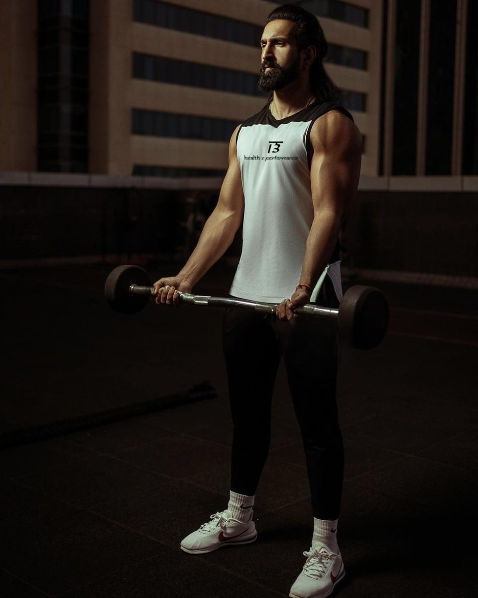 Personal trainer coaching a client at 13 Health & Performance, Downtown Dubai